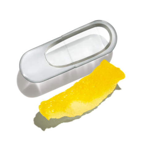 Natal Choline pill next to a lemon rind