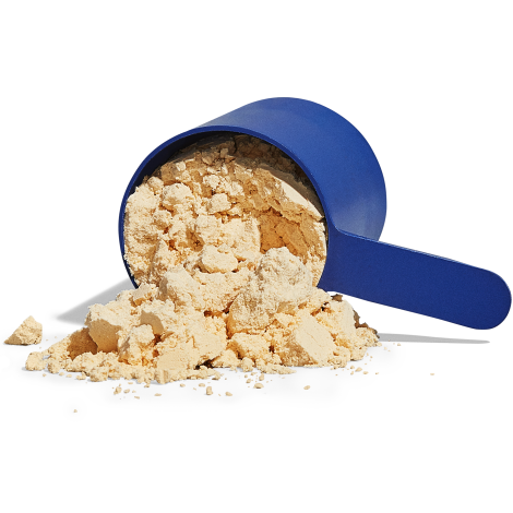 Protein scoop tilted over with protein powder spilling out of it